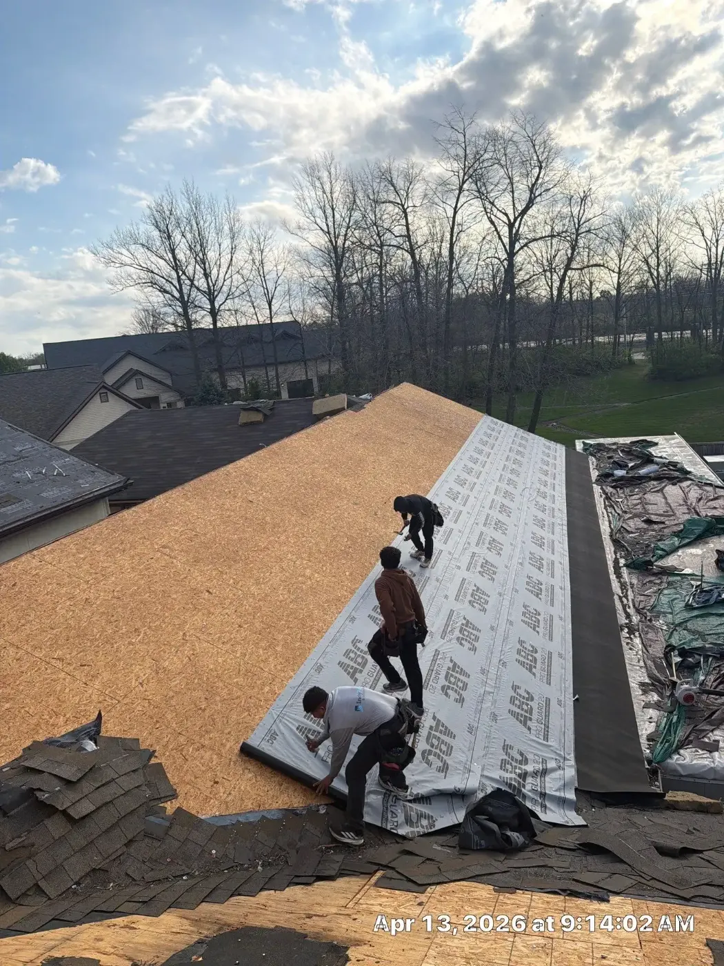 Tarping and dry-in on a Avon commercial roof